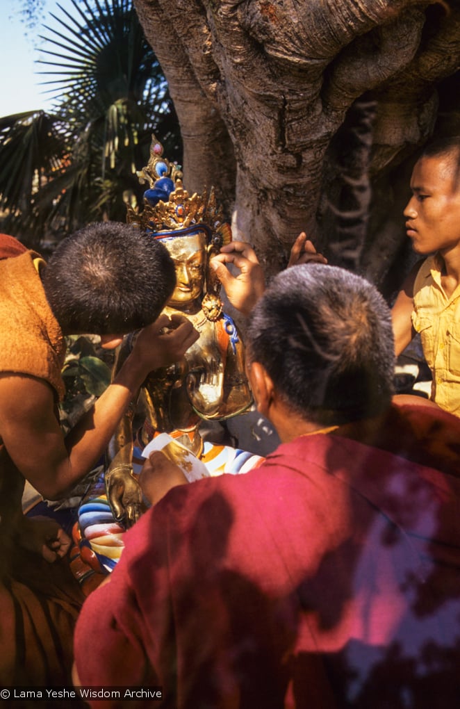 (06476_sl.JPG) Lama Yeshe painting Tara, Kopan Monastery, Nepal, 1976. Lama Yeshe sent Max Mathews to buy a large Tara statue in Kathmandu, which was eventually placed in a glass-fronted house on a pedestal overlooking a triangular pond that was built under the ancient bodhi tree in front of the gompa, Kopan Monastery, Nepal. Photo by Peter Iseli.