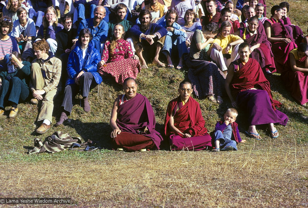 (09466_sl-2.psd) Lama Yeshe and Lama Zopa Rinpoche in a group photo from the 8th Meditation Course at Kopan Monastery, Nepal, 1975. In the center is Lama Yeshe and Lama Zopa Rinpoche, with Thor Kolb next to him, then Marcel Bertels seated above. To the left of Marcel in the yellow is Wendy Finster.