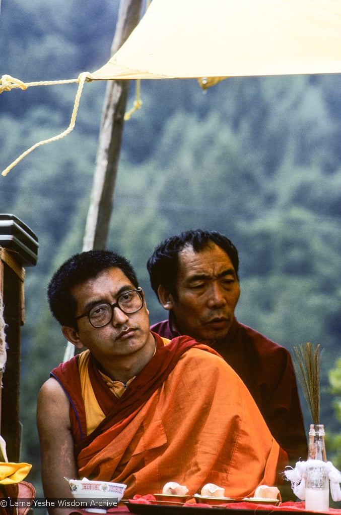 (10074_sl.JPG) Lama Zopa Rinpoche and Geshe Gyeltsen at the cremation of Lama Yeshe at Vajrapani Institute, California in March of 1984. Photo by Ricardo de Aratanha.