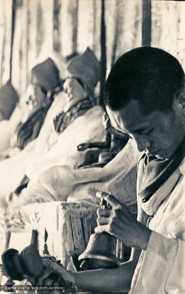 (13300_pr-2.psd) Lama Zopa Rinpoche doing puja (spiritual practice) during the Fourth Meditation Course, Kopan Monastery, Nepal, 1973. Photo by Brian Beresford.