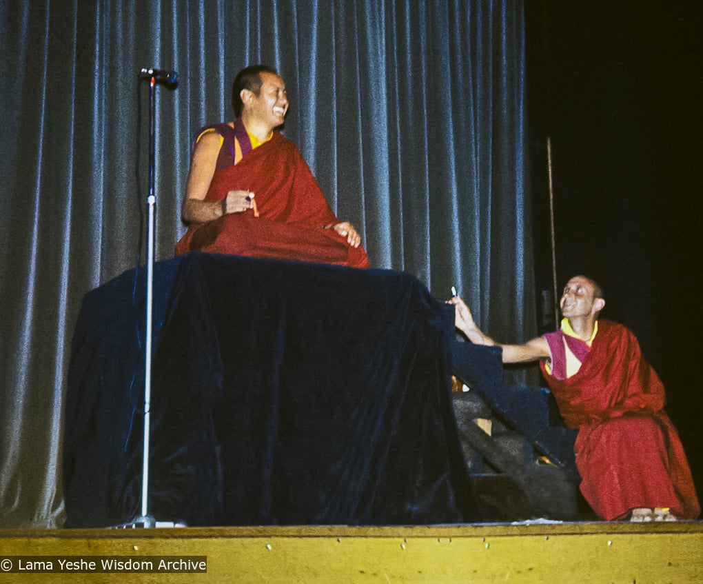 Lama Yeshe giving a public talk (with Nick Ribush at the right), Melbourne University, Australia, 1975.