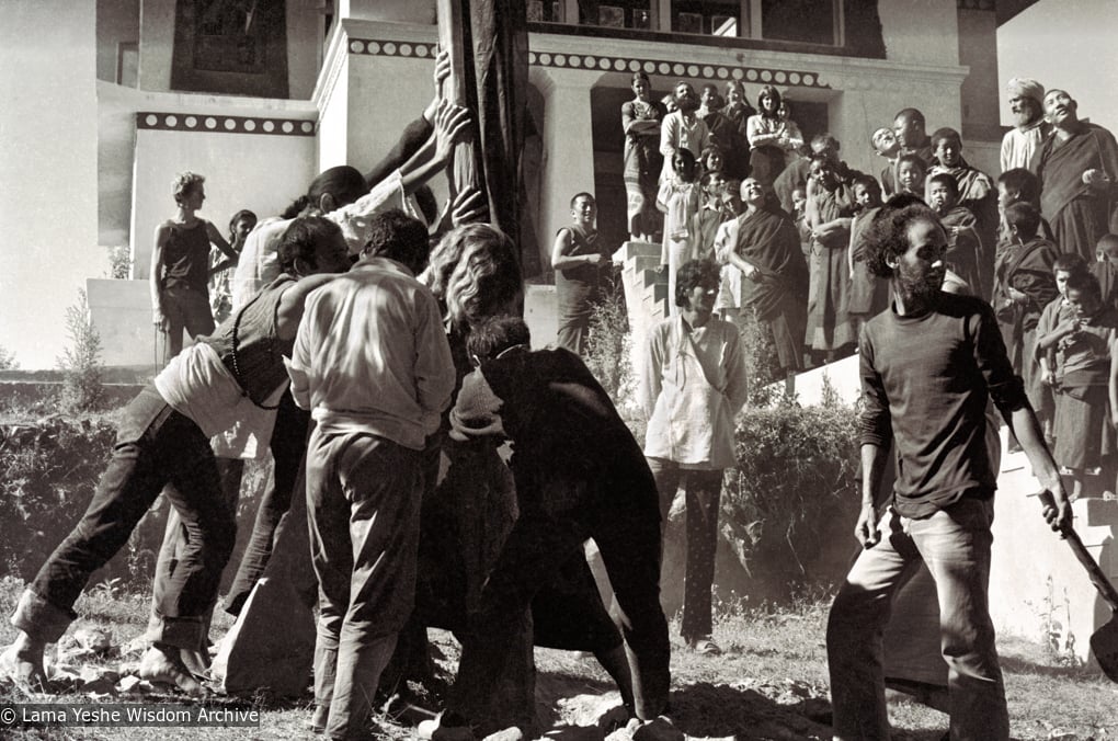 (15155_ng.psd) Raising the prayer flag pole at Kopan Monastery, Nepal, 1972. In attendance are some Mount Everest Center monks and students from the third Kopan course. Nick Ribush, an early student of the Lamas, is at the front right.