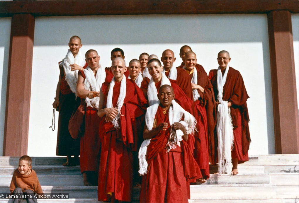 (15469_ud.psd) Ordination photo of western Dharma students including Gareth Sparham, Marcel Bertels, Ama-la (Mother of Lama Zopa), Nick Ribush, Nicole Couture, Thubten Pemo (Linda Grossman), Thubten Pende (Jim Dougherty), Ursula Bernis, Thubten Wongmo  (Feather Meston), Yeshe Khadro (Marie Obst) and Daja Meston (Thubten Wangchuk), son of Wongmo, on the steps to the left. It is interesting to note that Lama Yeshe and Lama Zopa Rinpoche are both in the photo, but hiding behind the heads of the new