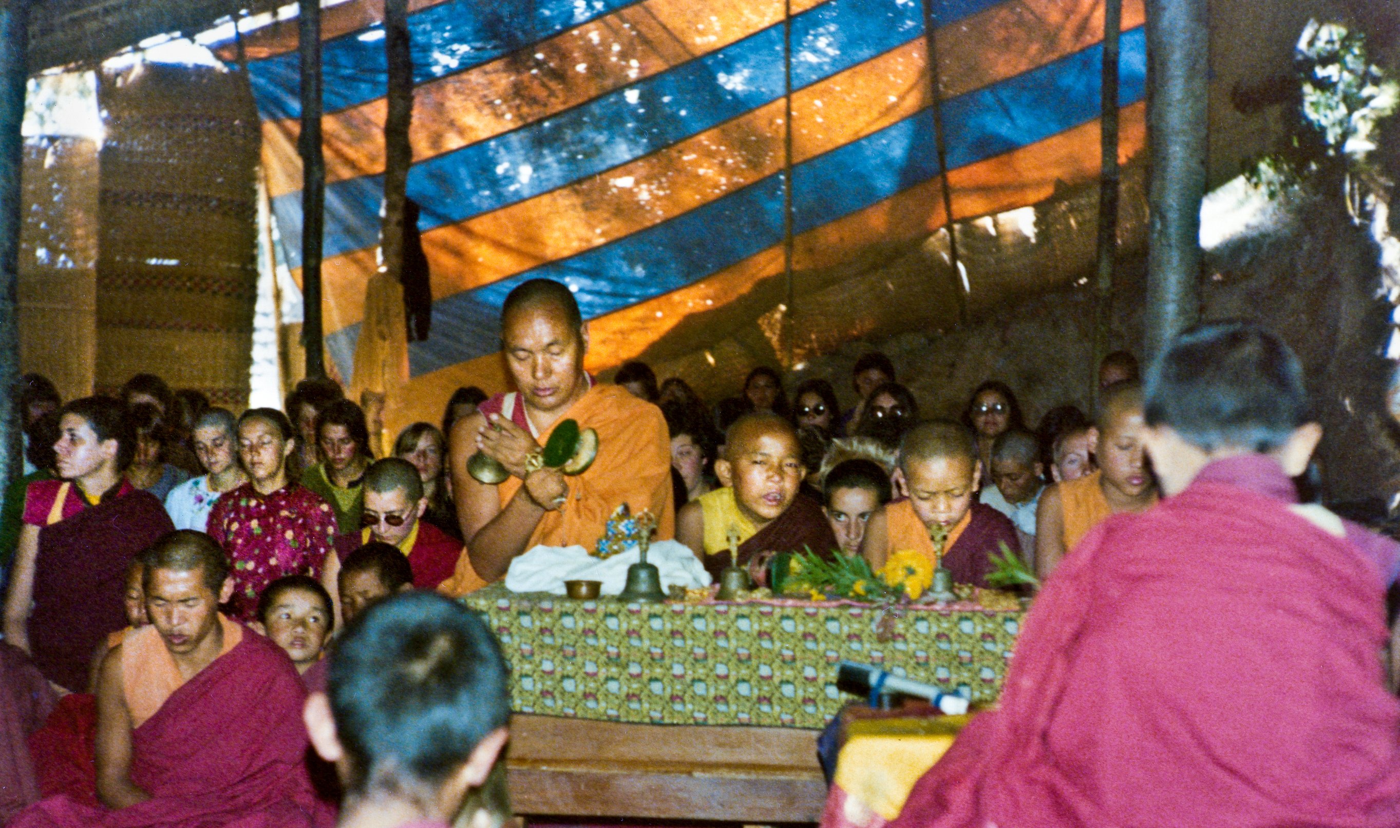 (15601_pr-2.psd) Lama Yeshe doing puja. Next to Lama Yeshe is Gelek Gyatso, Charok Lama (Tenzin Dorje), and Thubten Zopa (Tenzin Norbu). On the left is Thubten Pemo (Linda Grossman), Aleca Moriatis, and Nicole Couture. Photo from the 8th Meditation Course at Kopan Monastery, Nepal, 1975.