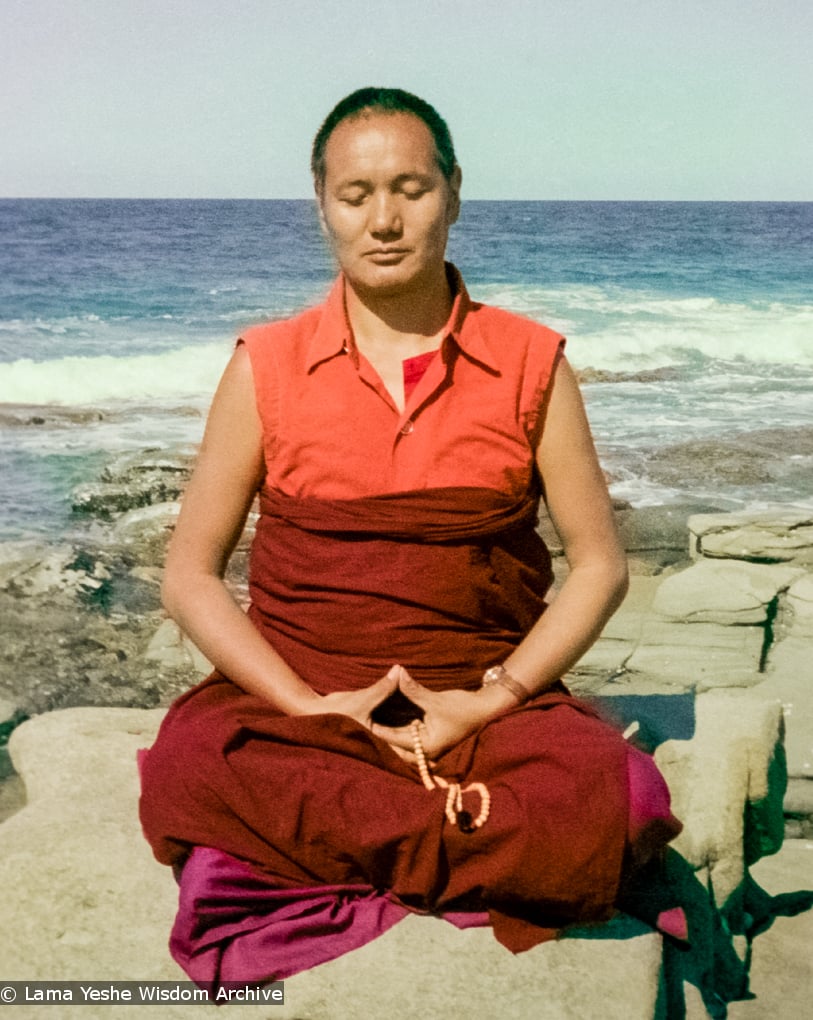 (15849_ng.tif) Lama meditating by the ocean, Maroochydore, Australia, 1974. The lamas took a day off during the Diamond Valley course to go to the beach in Tom Vichta's van. Everyone got out to enjoy the view from the cliffs, but Lama Yeshe ran straight down to the water's edge, hitched up his robes, and waded in, splashing about with delight.