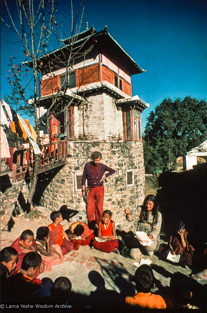 (15866_sl.psd) Westerners teaching the Mount Everest Center students at the foot of Steve's Tower, possibly 1974. An American student, Steve Malasky (Now Steve Pearl), built a Tibetan tower at one end of the Kopan land which came to be known as "Steve's Tower". Kopan Monastery, Nepal, 1974