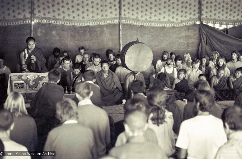 (15883_sl.psd) Photo of the lamas and sangha doing puja in the tent, Kopan Monastery, Nepal, 1974. For the Seventh Meditation Course a huge Indian wedding tent replaced the dusty burlap-walled tent.