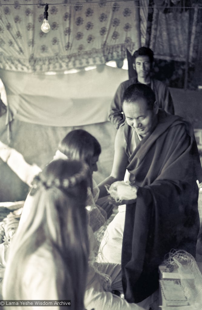 (15885_sl.psd) Lama Yeshe performing a wedding for John Morrison and Anne Ogburn in the meditation tent, Kopan Monastery, Nepal, 1974.