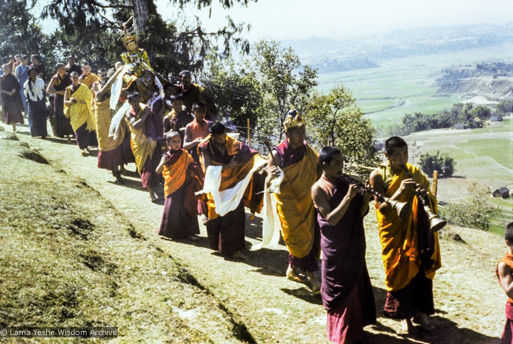 (16703_ng.tif) Lama Yeshe, Lama Zopa Rinpoche, and Yangsi Rinpoche in a procession circumambulating Kopan Monastery with the Tara statue prior to it's installation, Nepal, 1976.