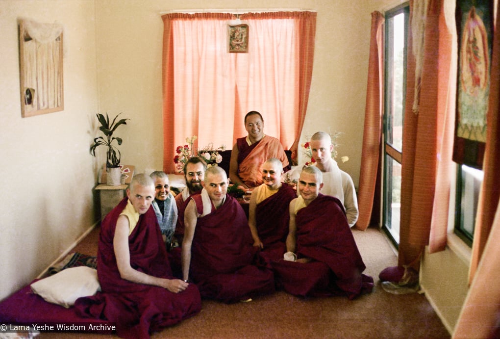 (16744_ng-3.psd) Lama Yeshe with new Sangha at rabjung ordination, Chenrezig Institute, Australia, 1976. From the left: Nigel, unknown woman,  Uldis Balodis (with beard), Charlie Topp (front center), Helen McCallum (Yeshe Dorje), and Tony Duff (right front). Behind Tony is Terry O'Neil. Lama  Yeshe is seated in the back.