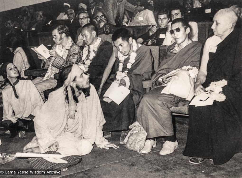 (18782_pr-3.psd) Lama Yeshe's first public speaking engagement at the International Yoga Conference in Delhi, India, 1970. Lama Zopa Rinpoche is in the centre, Lama Yeshe is to the left, Freda Bedi is at far right. On the far left is Terry Clifford. In the row behind the lamas is Piero Cerri and Claudio Cipullo.