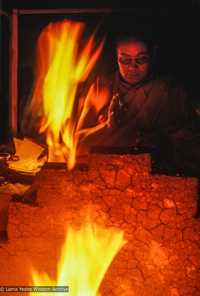 Lama Yeshe performing a fire puja at Tushita Retreat Centre, Dharamsala, India, 1983.