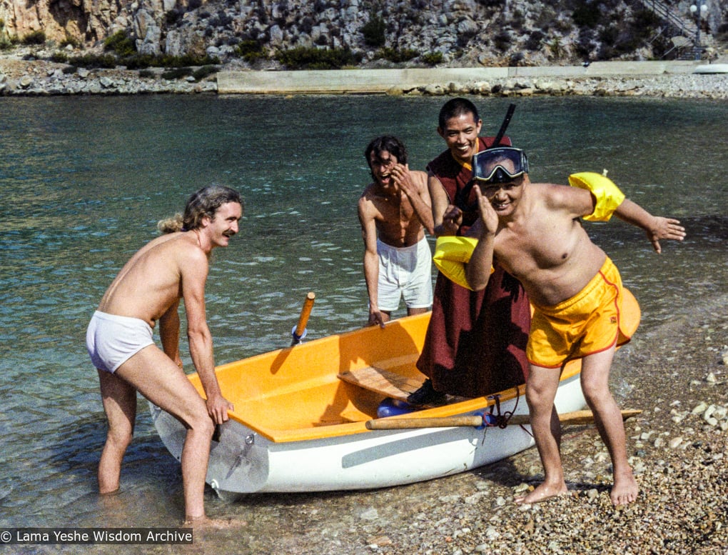 (22162_ng-3.tif) Lama Yeshe on vacation, Ibiza, Spain, 1978. Also in the photo: Paco Hita (father of Osel), Philippe Camus, Tenzin Wangchuk.