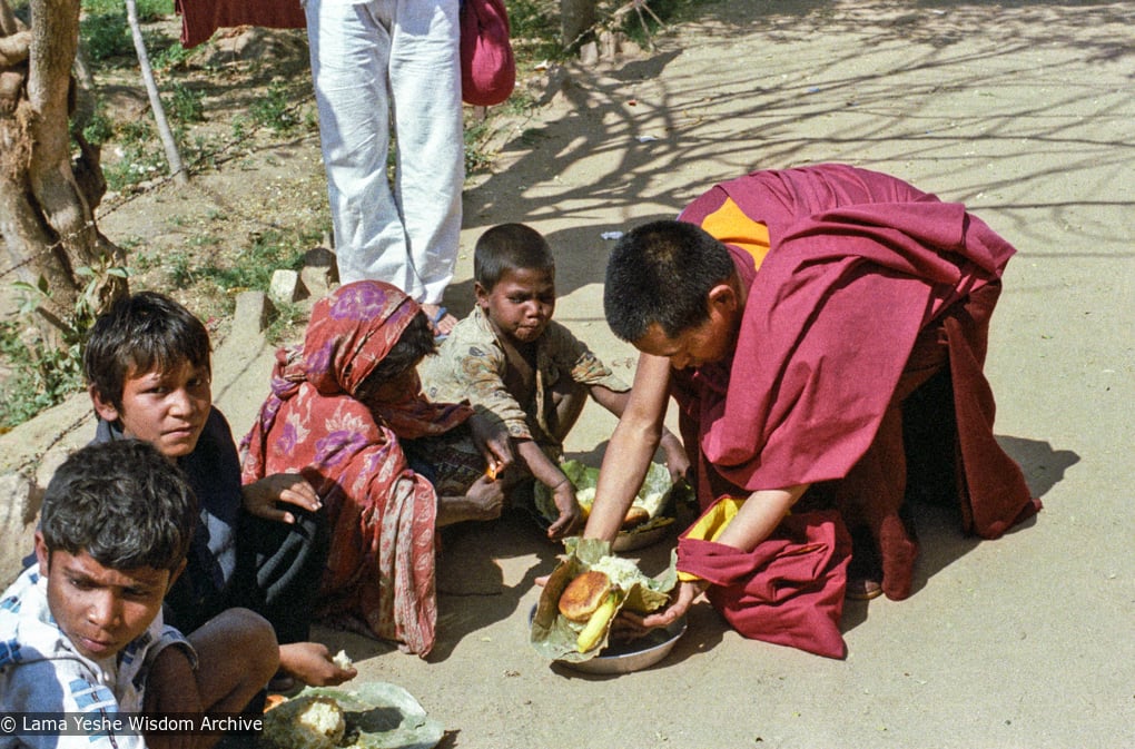 (23255_ng-3.psd) Beggars' banquet, Bodhgaya, India, 1982. Lama Zopa Rinpoche feeding people on the street.