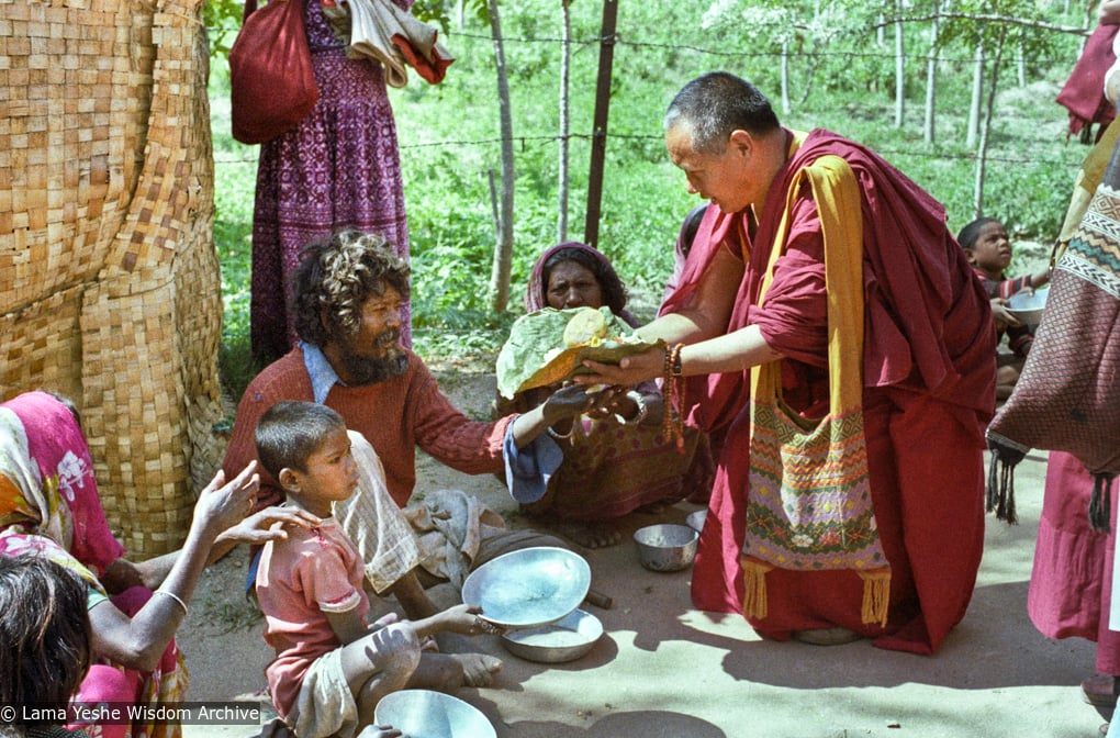 (23283_ng-3.psd) Beggars' banquet, Bodhgaya, India, 1982. Lama Yeshe feeding people on the street.