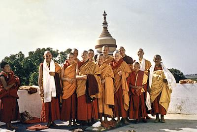 Click to view in our Image Gallery A post-ordination photo of western Dharma students. Left to right: Nick Ribush, Yeshe Khadro (Marie Obst), Tubten Pende (Jim Dougherty), Nicole Couture (Kedge), Thubten Pemo (Linda Grossman), Thubten Wongmo (Feather Meston), Marcel Bertels, Debra (Spring) Livingston (Thubten Chokey), Ursula Bernis, an unknown young Tibetan nun, Gareth Sparham, and Ama-la (Lama Zopa Rinpoche's mother). Bodhgaya, India, 1974.