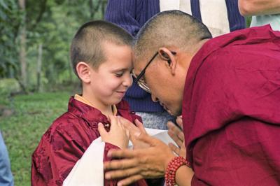 Lama Zopa Rinpoche visiting Chenrezig Institute with Osel, 1991. Photo by Thubten Yeshe. 