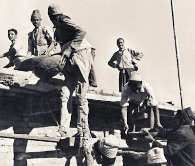 Lama Yeshe as foreman, supervising the construction of Kopan gompa, Nepal, 1972.