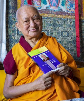 Lama Zopa Rinpoche with LYWA publication "The Nectar of Bodhicitta", October 2021. Photo: Lobsang Sherab.