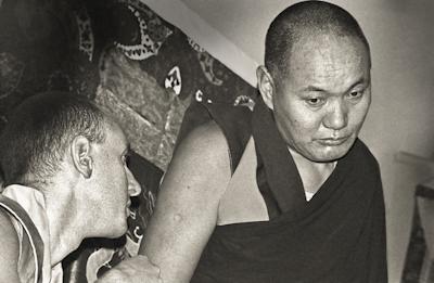 Lama Yeshe giving a public talk at Kensington Town Hall, England, 1975. Nick Ribush is at the lower left. 