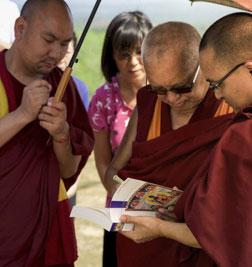 Lama Zopa Rinpoche signing books in Malaysia in 2016. Photo: Bill Kane.