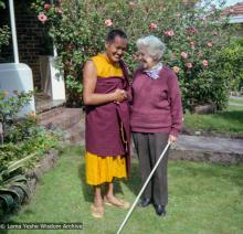 (09309_ng-3.JPG) Lama Yeshe and Myra Slade in the front yard of Beatrice Ribush's home in Melbourne, Australia, 1979.