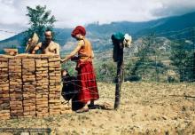 (13536_pr2.jpg) The first bricks to build Kopan Monastery, 1971 (The Monk is named Dennis, the student to his left is unknown.)