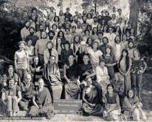 (13869_pr.psd) Portrait of the lake Arrowhead retreat group. Lama Zopa Rinpoche and Lama Yeshe are on the bench in the center. Behind Lama is Carol Royce-Wilder who took many of the photos at Lake Arrowhead. By the sign at the bottom and to the left is Nick Ribush and Thubten Wongmo (Feather Meston), to the right is Sister Max Mathews. This photo is from a three week retreat the lamas taught at Camp Arrowpines on Lake Arrowhead, east of Los Angeles, USA, 1975.