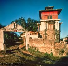 (15168_sl.psd) The front gate at Kopan showing Steve's Tower on the right. Steve Malasky, an American student, built a Tibetan tower at one end of the Kopan land which came to be known as "Steve's Tower".