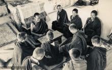 (15484_pr.psd) Lama Yeshe, Lama Zopa Rinpoche, Lama Lhundrup, and Lama Pasang with new monastics including Nick Ribush and Yeshe Khadro (Marie Obst) in the gompa (shrineroom) at Kopan Monastery, Nepal, 1974.