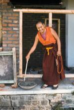 (15864_sl.tif) Lama Yeshe mixing cement for ongoing construction projects at Kopan Monastery, Nepal, 1974.