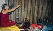 (15974_ng-3.psd) Lama Yeshe giving a public talk, Adyar Theater, Sydney, Australia, 8th of April, 1975. Lama Zopa Rinpoche can be seen sitting by the wall.