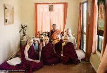 (16744_ng-3.psd) Lama Yeshe with new Sangha at rabjung ordination, Chenrezig Institute, Australia, 1976. From the left: Nigel, unknown woman,  Uldis Balodis (with beard), Charlie Topp (front center), Helen McCallum (Yeshe Dorje), and Tony Duff (right front). Behind Tony is Terry O'Neil. Lama  Yeshe is seated in the back.