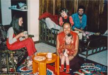 (18895_pr-3.psd) Lama Yeshe at home with the Feldmanns, Melbourne, AU, 1979. Lila Feldmann is on Lama's knee. Rita Feldmann (donor)