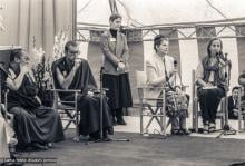 (20601_ng-3.psd) Universal Education conference, Istituto Lama Tzong Khapa, Pomaia, Italy, 1982, Luca Corona translating for H.H. 14th Dalai Lama, Connie Miller standing. Brian Beresford (photographer)