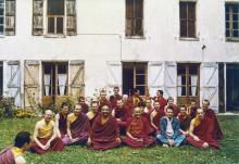 (21141_pr-3.psd) International Mahayana Institute Sangha, Nalanda Monastery, Lavaur, France, 1983. Photo includes  Adrian Feldmann (Thubten Gyatso), Chodron Thubten (Cherry Greene), Dieter Kratzer, Lama Yeshe, Merry Colony, Sangye Khadro (Kathleen McDonald), Geshe Jampa Tegchok. Included in the photo a local priest, Father Bastiani, wearing blue.