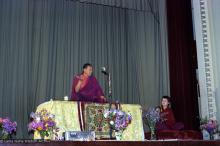 (22156_ng.tif) Lama Yeshe teaching at Malvern Town Hall, Australia, 1979, with Tara House director Bonnie Rothenberg (Konchog Donma or KD) on the right.