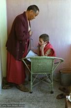 (23009_ng-3.psd) Daja Meston (Thubten Wangchuk) listening to Lama Yeshe's heart, Bodhgaya, India, 1982.