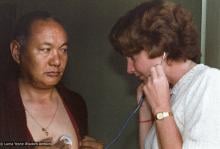 (23036_ng-3.psd) Jacie Keeley listening to Lama Yeshe's heart, Bodhgaya, India, 1982.