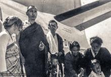 (32749_pr-3.psd) The lamas with Jhamba Dolkar (center), Tribhuvan Airport, Kathmandu, 1973. "Lama Yeshe and Lama Zopa Rinpoche had recently adopted Jhamba Dolkar, a young girl whose family circumstances were so desperate that her mother had begged the lamas to take care of her. “I can remember being at Kathmandu airport with Lama Yeshe and Lama Zopa standing on either side of me as I said good-bye to my family,” Jhamba Dolkar explained."