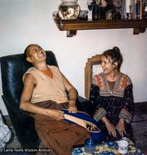 (39289_pr-3.psd) Lama Yeshe and Gabe Wallace, Melbourne, 1974.  Gabe Wallace (donor). Pete Northend: “I walked into our small flat and it was really crowded. Bea Ribush was there and Colin Crosbie, Pete and Gabe. It’s a very small flat and you couldn’t overlook anybody. So I stood there with the flagon under my arm while they all looked at me and packed up laughing. What I didn’t know was that Lama Yeshe was sitting right beside me with his zen pulled over his face. Somehow that had made him inv