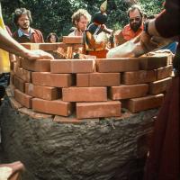 Click to view in our Image Gallery (00652_ud.jpg) Lama Yeshe's body is placed in the cremation stupa. Cremation of Lama Yeshe at Vajrapani Institute, California in March of 1984. Photo includes Jack Morison. Photo by Ricardo de Aratanha.