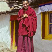 (04210_sl-6.psd) Lama Zopa Rinpoche in front of the Lawudo Lama cave, Lawudo Retreat Center, Nepal, 1978. Ueli Minder (photographer)