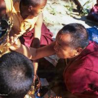 (06487_sl.JPG) Lama Yeshe painting Tara, Kopan Monastery, Nepal, 1976. Lama Yeshe sent Max Mathews to buy a large Tara statue in Kathmandu, which was eventually placed in a glass-fronted house on a pedestal overlooking a triangular pond that was built under the ancient bodhi tree in front of the gompa, Kopan Monastery, Nepal. Photo by Peter Iseli.