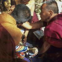 (06489_sl.JPG) Lama Yeshe painting Tara, Kopan Monastery, Nepal, 1976. Lama Yeshe sent Max Mathews to buy a large Tara statue in Kathmandu, which was eventually placed in a glass-fronted house on a pedestal overlooking a triangular pond that was built under the ancient bodhi tree in front of the gompa, Kopan Monastery, Nepal. Photo by Peter Iseli.