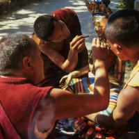 (06491_sl.JPG) Lama Yeshe painting Tara, Kopan Monastery, Nepal, 1976. Lama Yeshe sent Max Mathews to buy a large Tara statue in Kathmandu, which was eventually placed in a glass-fronted house on a pedestal overlooking a triangular pond that was built under the ancient bodhi tree in front of the gompa, Kopan Monastery, Nepal. Photo by Peter Iseli.