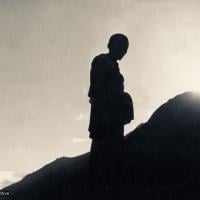 (07629_pr-2.psd) Silhouette of Lama Zopa Rinpoche on the mountainside, Lawudo Retreat Centre, Nepal, 1973.