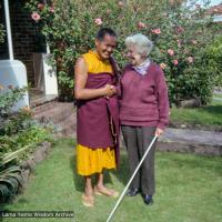 (09309_ng-3.JPG) Lama Yeshe and Myra Slade in the front yard of Beatrice Ribush's home in Melbourne, Australia, 1979.