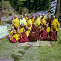 (09311_ng.JPG) Ordination group with HH Trijang Rinpoche, 1976. Front row: Karin Valham, Lama Zopa Rinpoche, HH Trijang Rinpoche seated, Lama Yeshe, Geshe Jampa Wangdu. Second row: Margaret McAndrew, Angeles de la Torre, Steve Malasky (Steve Pearl), Wendy Finster, Thubten Pende (Jim Dougherty), Dieter Kratzer. Standing: Elisabeth Drukier, Scott Brusso, Roger Wheeler, Jeffery Webster, Marcel Bertels, John Feuille, Adrian Feldmann (Thubten Gyatso), Peter Kedge, Gareth Sparham, George Churinoff.