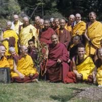 (09493_sl.JPG) Ordination group with Lama Yeshe, 1976. Front row: George Churinoff (Karin Valham behind him), Elisabeth Drukier, Dieter Kratzer, (Losang Nyima behind him), Lama Yeshe, Thubten Pende (Jim Dougherty), Steve Malasky (Steve Pearl). Gareth Sparham and Marcel Bertels are behind Pende and Steve. Back row (standing): Margaret McAndrew, Adrian Feldmann (Thubten Gyatso), Scott Brusso, Ursula Bernis, Wendy Finster, unknown tibetan monk, in back Angeles de la Torre, Jeffery Webster, unknown 